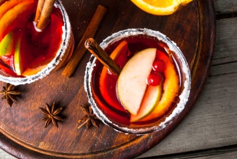 autumn and winter sangria with oranges, apples, cranberries and spices