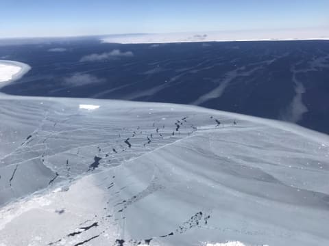 A view across sea ice toward A-68