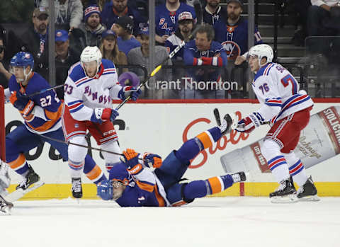 NEW YORK, NEW YORK – NOVEMBER 15: Fredrik Claesson #33 and Brady Skjei #76 of the New York Rangers combine to dump Jordan Eberle #7 of the New York Islanders during the first period at the Barclays Center on November 15, 2018 in the Brooklyn borough of New York City. (Photo by Bruce Bennett/Getty Images)