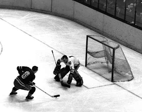 NEW YORK, NY – MARCH 10: Bob Nevin #8 of the New York Rangers looks to score on goalie Glenn Hall #1 of the Chicago Blackhawks on March 10, 1965 at the Madison Square Garden in New York, New York. (Photo by B Bennett/Bruce Bennett Studios/Getty Images)