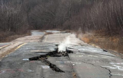 Smoke coming up from cracked concrete in Centralia, Pennsylvania.