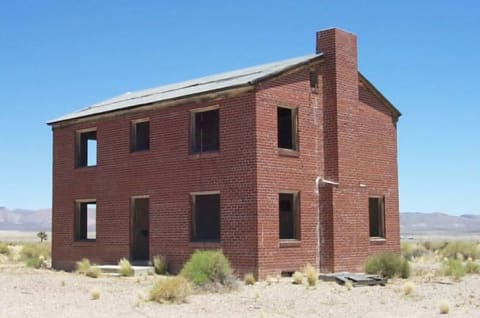 A building built to test a nuclear reaction in Survival Town, Nevada.