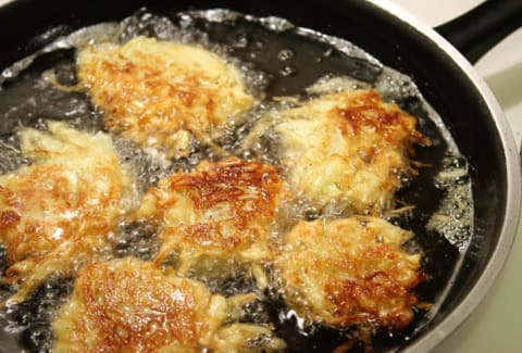 frying latkes in a pan