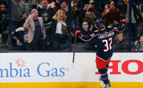 Mar 1, 2022; Columbus, Ohio, USA; Columbus Blue Jackets defenseman Jake Christiansen (32) celebrates a goal against the New Jersey Devils during the first period at Nationwide Arena. Mandatory Credit: Russell LaBounty-USA TODAY Sports