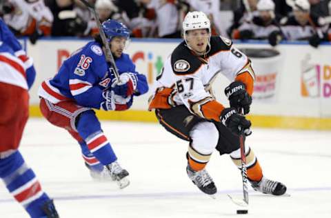 NHL Power Rankings: Anaheim Ducks center Rickard Rakell (67) controls the puck against New York Rangers right wing Mats Zuccarello (36) during the third period at Madison Square Garden. Mandatory Credit: Brad Penner-USA TODAY Sports