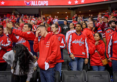 WASHINGTON, DC – APRIL 24: Washington Capitals fans react after losing to the Carolina Hurricanes in double overtime during game seven of the Stanley Cup Playoffs. (Photo by Jonathan Newton / The Washington Post via Getty Images)