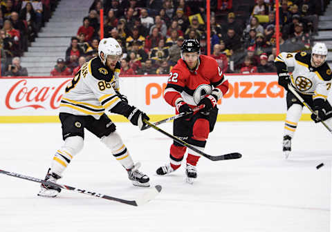 OTTAWA, ON – DECEMBER 09: Boston Bruins Right Wing David Pastrnak (88) lets a shot go as Ottawa Senators Defenceman Nikita Zaitsev (22) attempts to block during the second period of the NHL game between the Ottawa Senators and the Boston Bruins on Dec. 9, 2019 at the Canadian Tire Centre in Ottawa, Ontario, Canada. (Photo by Steven Kingsman/Icon Sportswire via Getty Images)