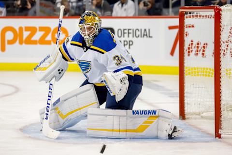 WINNIPEG, MB – OCTOBER 22: Goaltender Jake Allen #34 of the St. Louis Blues keeps an eye on the puck during first period action against the Winnipeg Jets at the Bell MTS Place on October 22, 2018 in Winnipeg, Manitoba, Canada. (Photo by Darcy Finley/NHLI via Getty Images)