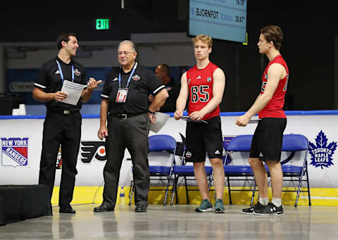 BUFFALO, NY – JUNE 1: Antti Saarela #85 and Patrik Puistola #105 await testing alongside Seth Spicer (on left) and Dan Marr, Director of NHL Scouting, during the 2019 NHL Scouting Combine on June 1, 2019 at Harborcenter in Buffalo, New York. (Photo by Bill Wippert/NHLI via Getty Images)