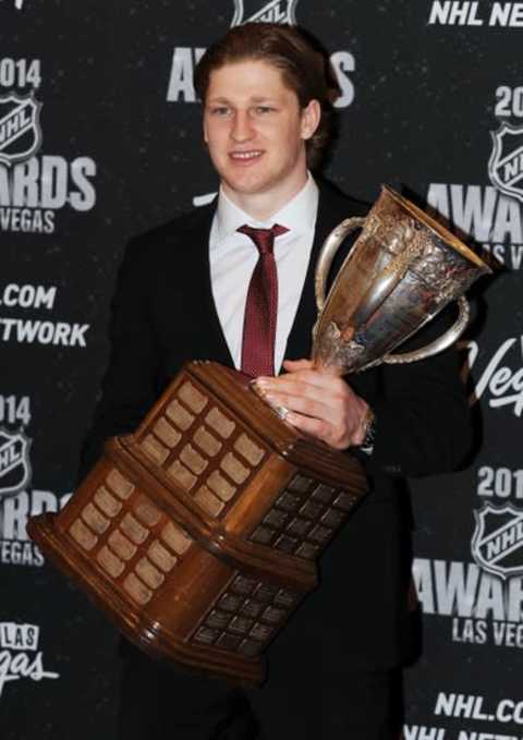 Jun 24, 2014; Las Vegas, NV, USA; Calder Trophy winner Nathan MacKinnon of the Colorado Avalanche poses with the trophy during the 2014 NHL Awards ceremony at Wynn Las Vegas. Mandatory Credit: Stephen R. Sylvanie-USA TODAY Sports