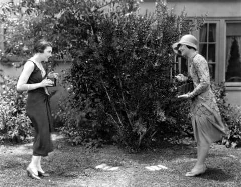 Two actresses taking pictures in 1925.