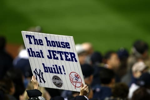 NEW YORK – NOVEMBER 04: A fan of the New York Yankees holds up a sign which reads ‘The House that Jeter built’ in reference to Derek Jeter