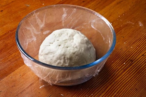 Dough sits in a bowl to rise.