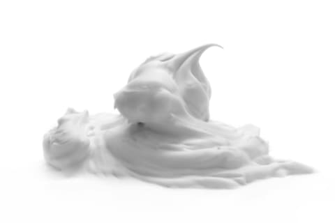 Fluffy white soap on a white background