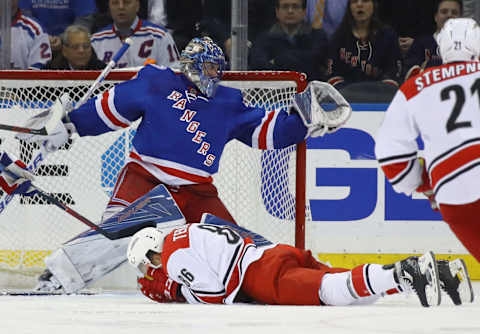 NEW YORK, NY – NOVEMBER 29: Henrik Lundqvist #30 of the New York Rangers makes the save as Teuvo Teravainen #86 of the Carolina Hurricanes is injured in front of the net during the second period at Madison Square Garden on November 29, 2016 in New York City. (Photo by Bruce Bennett/Getty Images)