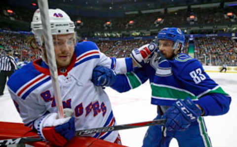 VANCOUVER, BC – MARCH 13: Jay Beagle #83 of the Vancouver Canucks checks Brendan Lemieux #48 of the New York Rangers during their NHL game at Rogers Arena March 13, 2019 in Vancouver, British Columbia, Canada. (Photo by Jeff Vinnick/NHLI via Getty Images)