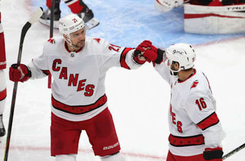 CHICAGO, ILLINOIS – FEBRUARY 02: Vincent Trocheck #16 of the Carolina Hurricanes is congratulated by Nino Niederreiter #21 after scoring a goal against the Chicago Blackhawks at the United Center on February 02, 2021 in Chicago, Illinois. The Hurricanes defeated the Blackhawks 4-3 in a shootout. (Photo by Jonathan Daniel/Getty Images)