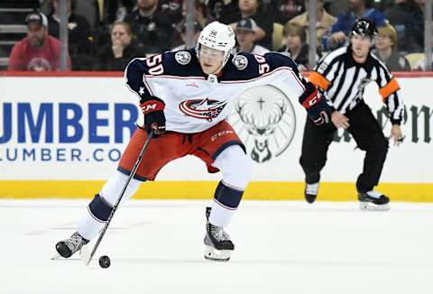 Sep 25, 2022; Pittsburgh, Pennsylvania, USA; Columbus Blue Jackets left wing Eric Robinson (50) moves the puck against the Pittsburgh Penguins during the second period at PPG Paints Arena. Mandatory Credit: Philip G. Pavely-USA TODAY Sports