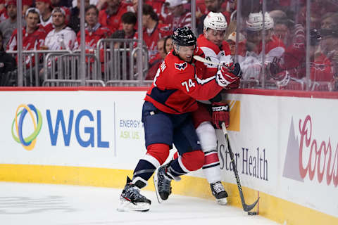 WASHINGTON, DC – APRIL 11: John Carlson #74 of the Washington Capitals and Micheal Ferland #79 of the Carolina Hurricanes battle for the puck in the second period in Game One of the Eastern Conference First Round during the 2019 NHL Stanley Cup Playoffs at Capital One Arena on April 11, 2019 in Washington, DC. (Photo by Patrick McDermott/NHLI via Getty Images)