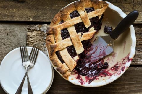 Half of a huckleberry lattice pie.