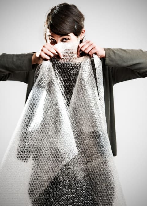 woman popping bubble wrap