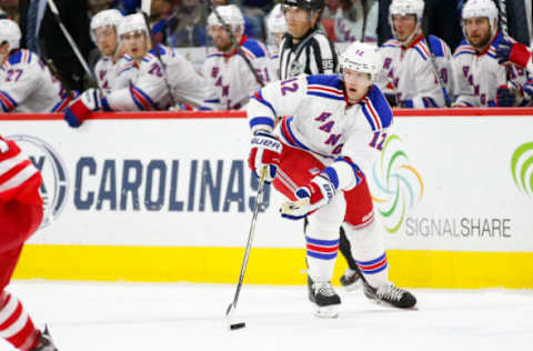 Mar 31, 2016; Raleigh, NC, USA; New York Rangers forward Eric Staal (12) skates with the puck against the Carolina Hurricanes during the third period at PNC Arena. The Hurricanes won 4-3. Mandatory Credit: James Guillory-USA TODAY Sports