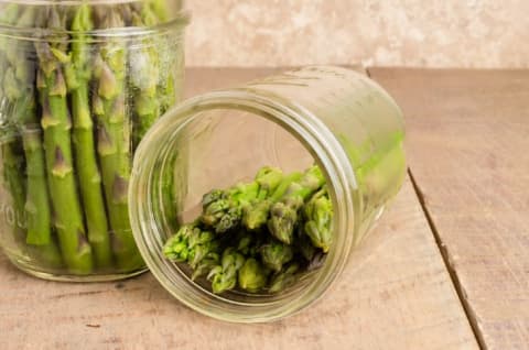 Asparagus in glass jars