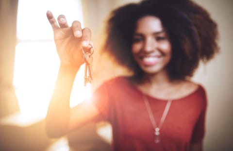 A woman dangles her keys in front of the camera.