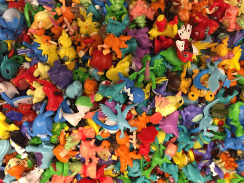 A large pile of colorful plastic toys