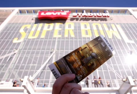 A fan holds up a ticket to Super Bowl 50 outside Levi's Stadium on February 7, 2016 in Santa Clara, California.