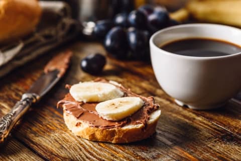 Nutetlla toast with a cup of coffee.