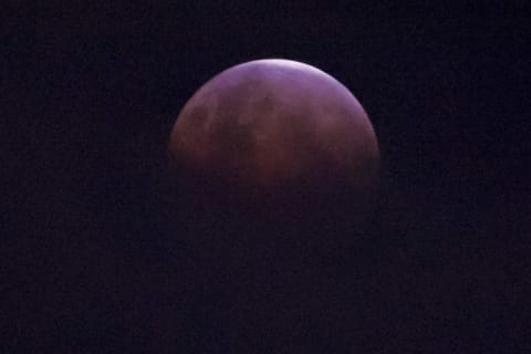 The moon shows its crown during a lunar eclipse referred to as the "super blue blood moon," in Jakarta, Indonesia, on January 31, 2018.