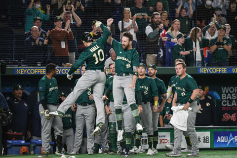 Australia’s Alex Hall (L) celebrates with teammates after hitting a first inning home run during the World Baseball Classic (WBC) Sunday. (Photo by Richard A. Brooks / AFP)