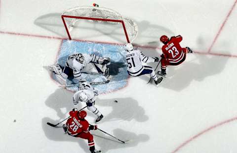 RALEIGH, NC – NOVEMBER 24: Elias Lindholm #28 of the Carolina Hurricanes shoots the puck on Frederik Andersen #31 of the Toronto Maple Leafs leading to a goal in the third period of an NHL game on November 24, 2017 at PNC Arena in Raleigh, North Carolina. (Photo by Gregg Forwerck/NHLI via Getty Images)