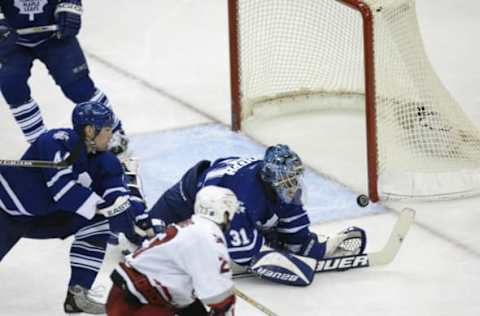 RALEIGH, NC – MAY 16: Martin Gelinas #23 of the Carolina Hurricanes has his shot stopped by Curtis Joseph #31 of the Toronto Maple Leafs during game one of the Eastern Conference Final series of the NHL Stanley Cup Playoffs between the Toronto Maple Leafs and the Carolina Hurricanes at the Raleigh Sports Arena in Raleigh, North Carolina on May 16, 2002. (Photo by Craig Jones/Getty Images/NHLI)