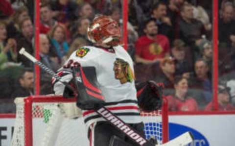 Mar 16, 2017; Ottawa, Ontario, CAN; Chicago Blackhawks goalie Scott Darling (33) takes a break during the second period against the Ottawa Senators at the Canadian Tire Centre. The Blackhawks defeated the Senators 2-1. Mandatory Credit: Marc DesRosiers-USA TODAY Sports