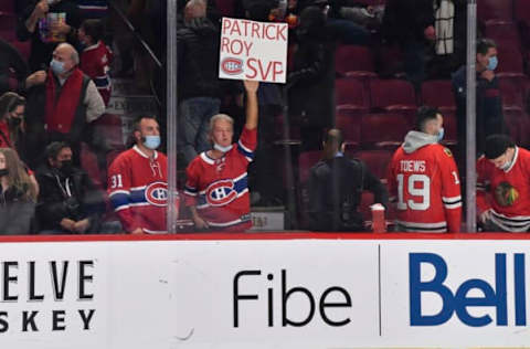 MONTREAL, QC – DECEMBER 09: Spectators hold up a sign asking for Patrick Roy”u2019s return, referring to filling the vacant general manager position for the Montreal Canadiens after the game against the Chicago Blackhawks at Centre Bell on December 9, 2021 in Montreal, Canada. The Chicago Blackhawks defeated the Montreal Canadiens 2-0. (Photo by Minas Panagiotakis/Getty Images)