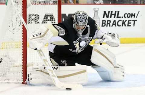 Mar 31, 2016; Pittsburgh, PA, USA; Pittsburgh Penguins goalie Marc-Andre Fleury (29) makes a save against the Nashville Predators during the first period at the CONSOL Energy Center. Mandatory Credit: Charles LeClaire-USA TODAY Sports