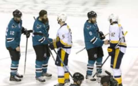 May 12, 2016; San Jose, CA, USA; San Jose Sharks center Joe Pavelski (8) and defenseman Brent Burns (88) and center Patrick Marleau (12) shake hands with Nashville Predators center Mike Fisher (12) and defenseman Barret Jackman (5) after the end of the game seven of the second round of the 2016 Stanley Cup Playoffs at SAP Center at San Jose. San Jose defeated Nashville 5-0. Mandatory Credit: Neville E. Guard-USA TODAY Sports