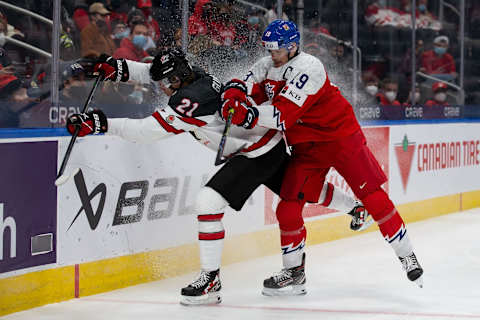 EDMONTON, AB – DECEMBER 26: Kaiden Guhle of Canada battles Jan Mysak. (Photo by Codie McLachlan/Getty Images)