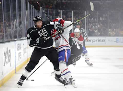 Vladislav Gavrikov #84 of the Los Angeles Kings reacts as he collides with Alex Belzile #60 of the Montreal Canadiens (Photo by Harry How/Getty Images)