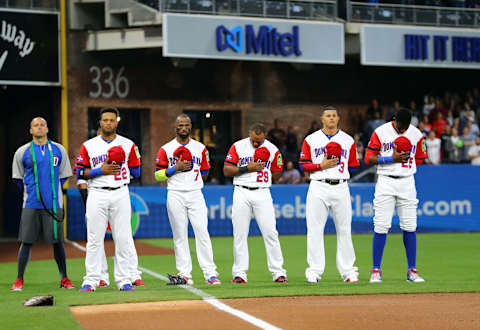 SAN DIEGO, CA – MARCH 18: Robinson Cano #22, Jose Reyes #7, Adrian Beltre #29, Manny Machado #3 and Gregory Polanco #25 of Team Dominican Republic stand during the national anthem before Game 6 of Pool F of the 2017 World Baseball Classic against Team USA on Saturday, March 18, 2017 at Petco Park in San Diego, California. (Photo by Alex Trautwig/WBCI/MLB Photos via Getty Images)