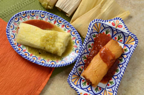 Tamales on a plate with salsa