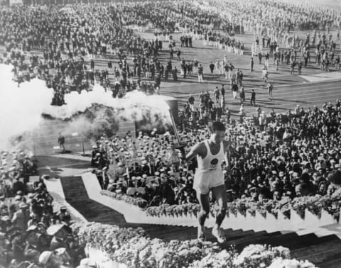 Man carrying olympic torch.