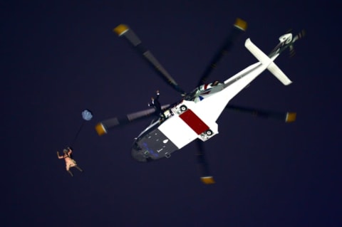 Person jumping from helicopter.