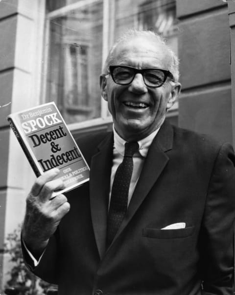 Dr Benjamin Spock, noted for his ideas on child-rearing, on a visit to Britain.