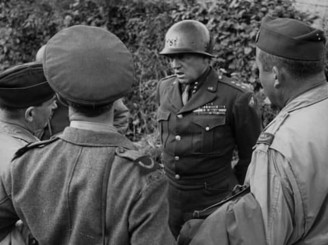 August 1944: General George S Patton (1885-1945), Head of the 3rd Army, talks to Allied war correspondents in Normandy.