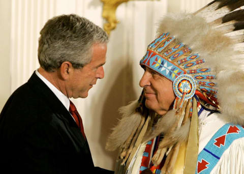 U.S. President George W. Bush shakes hands with Sen. Ben Nighthorse Campbell (R-CO) during a ceremony in the East Room at the White House.