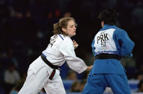 Hillary Wolf of the United States moves in for the attack against San Hui Kye of Korea in the Womens 52 kg Judo match at the Sydney Exhibition Centre during the Sydney Olympic Games in Sydney, Australia.