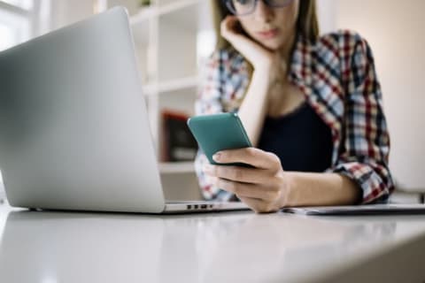 woman checking phone